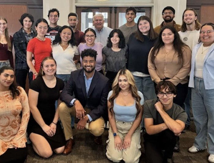 Associated Students (AS) executive team posing with President Roger Thompson after an AS meeting